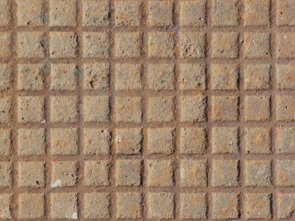 Seamless metal tread texture in brown tone with gridded pattern and very worn surface.